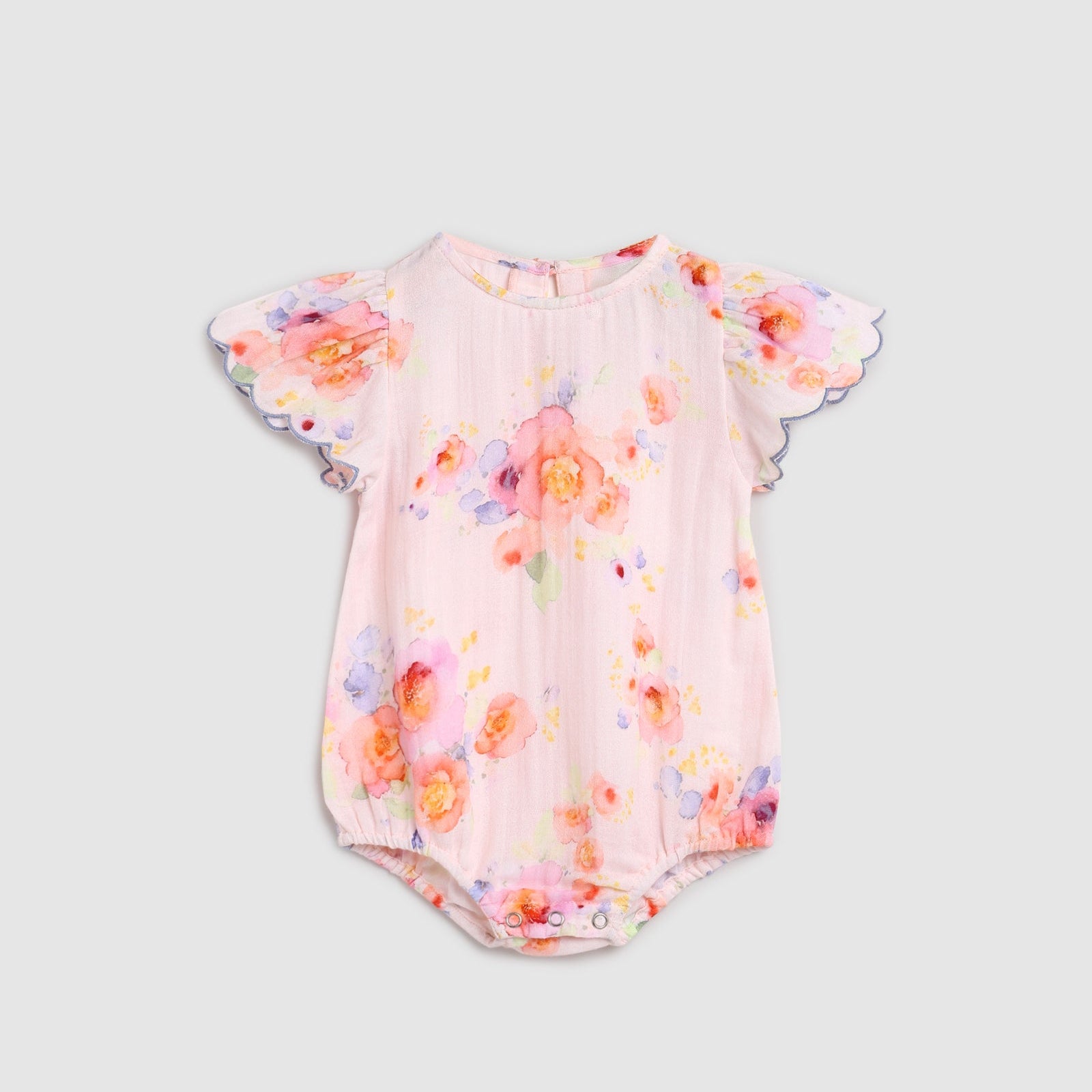 Floral baby romper on a light gray background